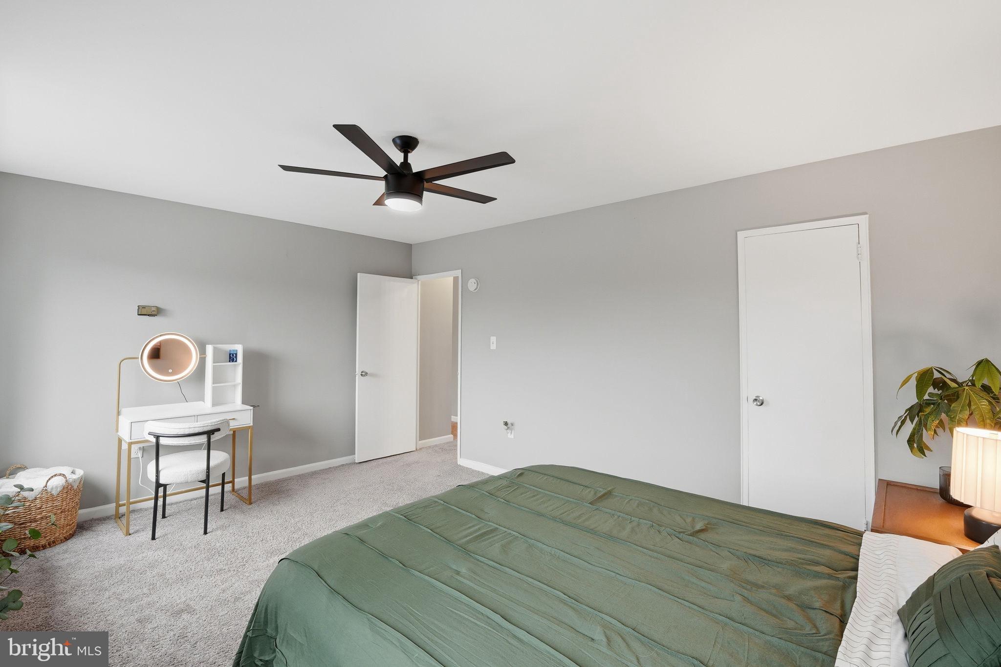 1300 South Arlington Ridge Road, Unit 204 Arlington, VA 22202 - Photo 18 of 35 a bedroom with a bed and a chandelier