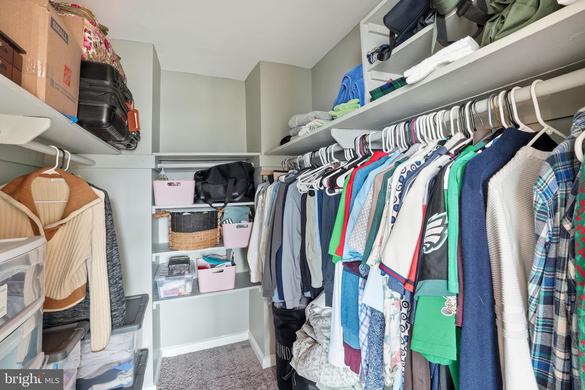 1300 South Arlington Ridge Road, Unit 204 Arlington, VA 22202 - Photo 19 of 35 a view of walk in closet with clothes and shoes