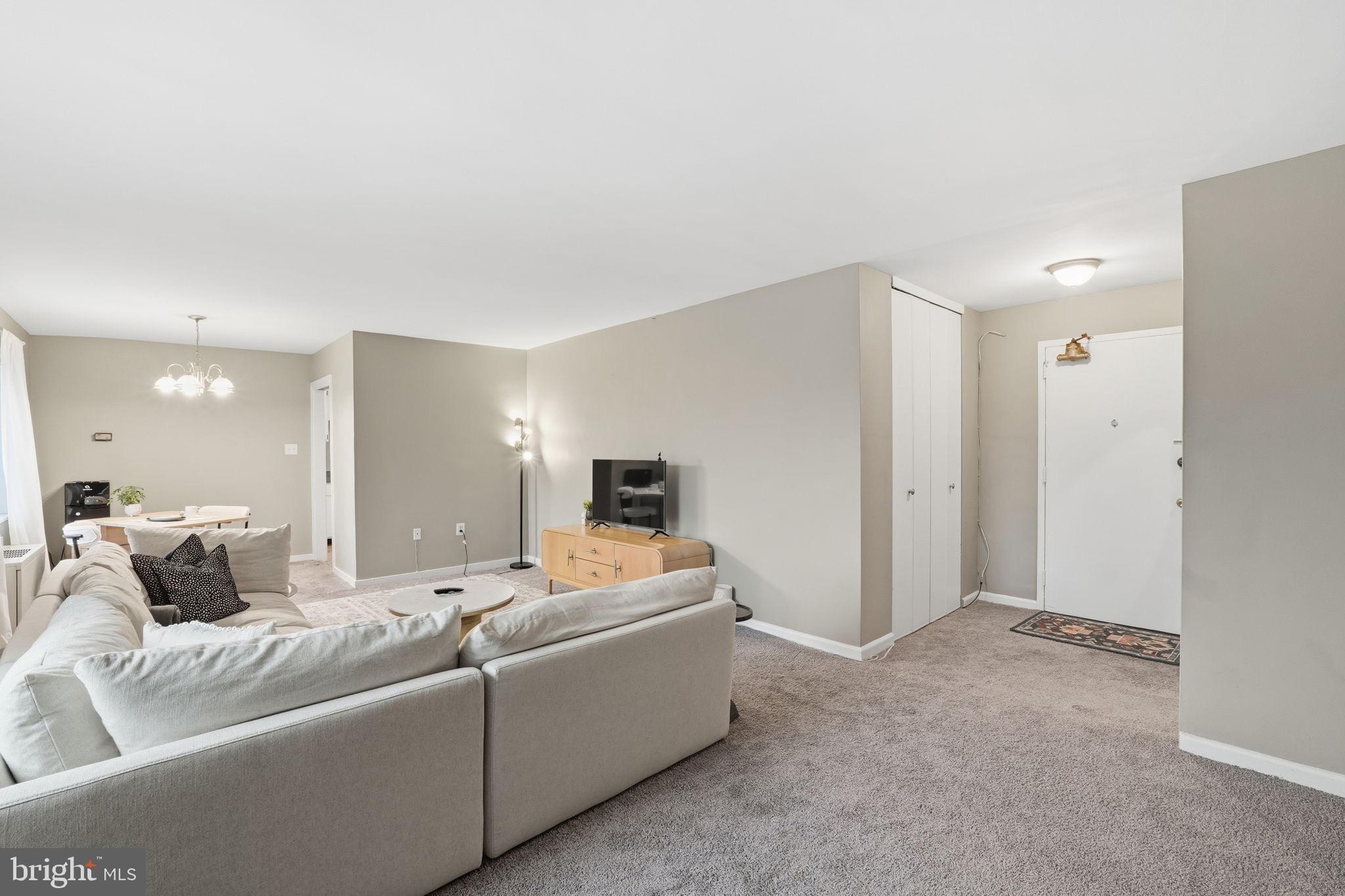 1300 South Arlington Ridge Road, Unit 204 Arlington, VA 22202 - Photo 3 of 35 a living room with furniture and a couch