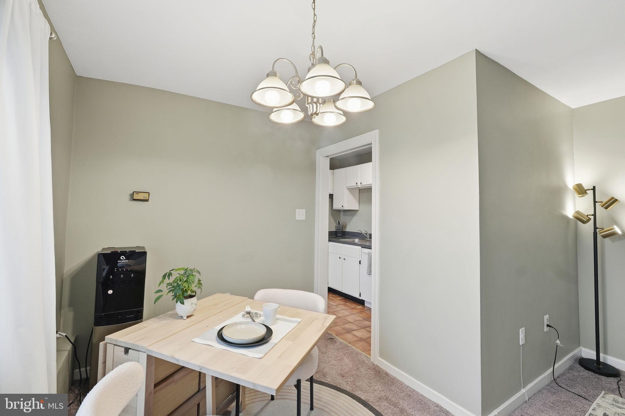 1300 South Arlington Ridge Road, Unit 204 Arlington, VA 22202 - Photo 10 of 35 a view of a dining room with furniture and wooden floor
