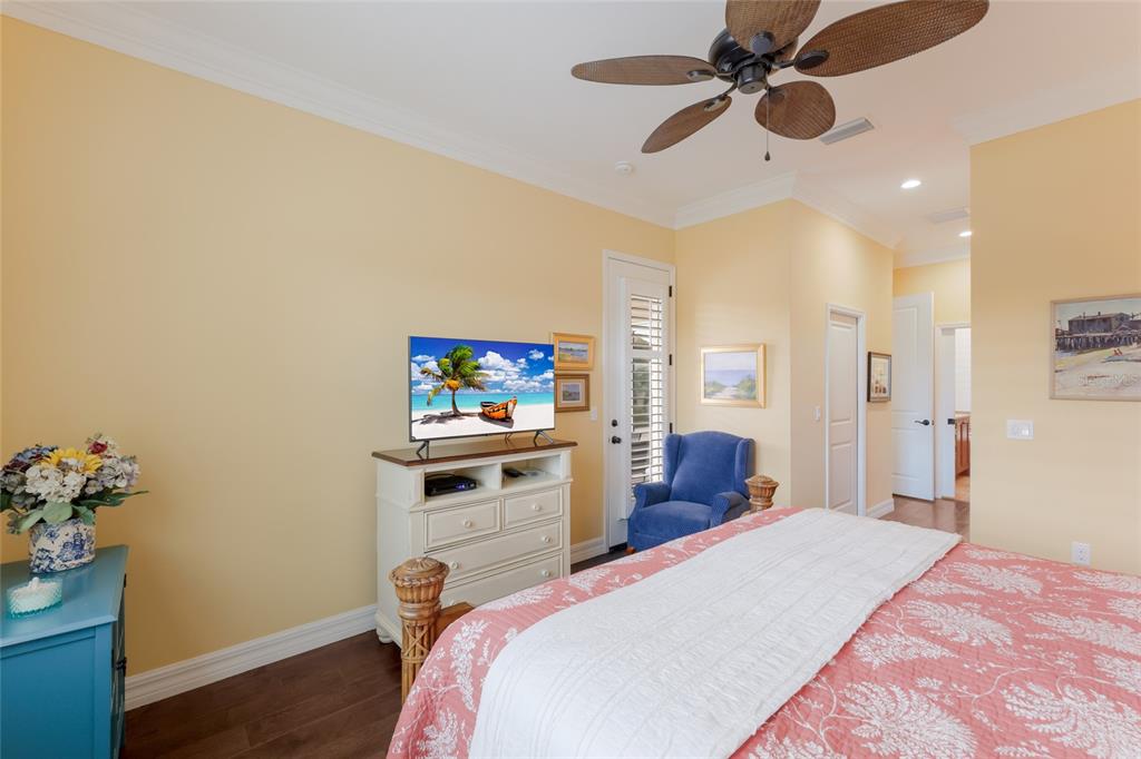 5011 Tobermory Way Bradenton, FL 34211 - Photo 17 of 77 a bedroom with a bed and a painting on the wall