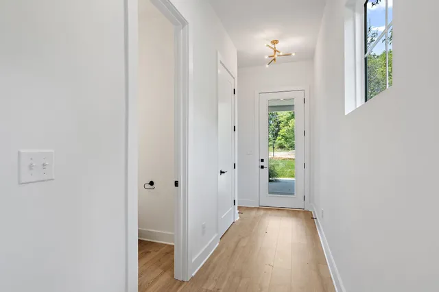 a bathroom with a sink mirror and toilet