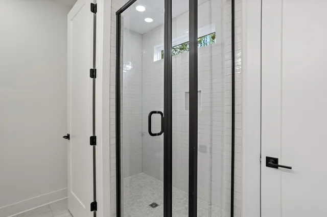 a view of backyard with wooden fence