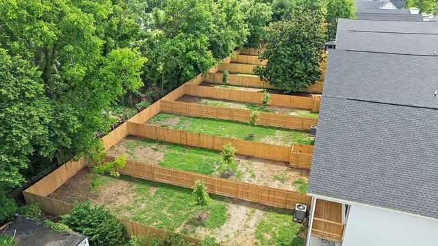 an aerial view of residential houses with outdoor space