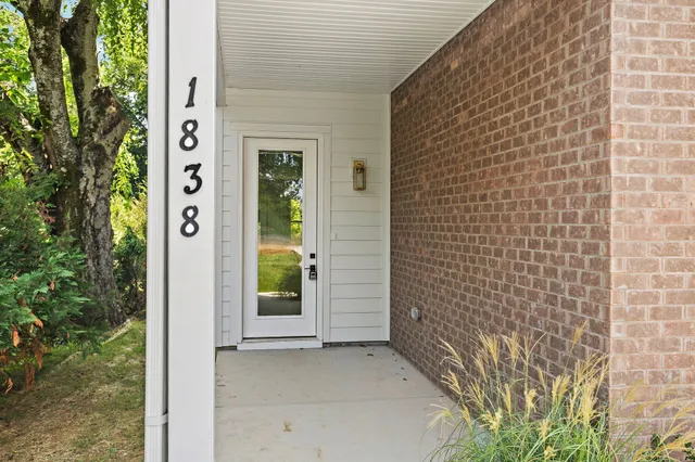 a view of a brick house with a window