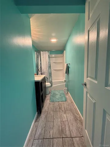 a view of a hallway with seating area