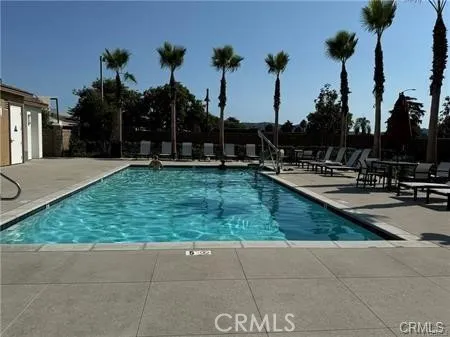 a view of a backyard with swimming pool