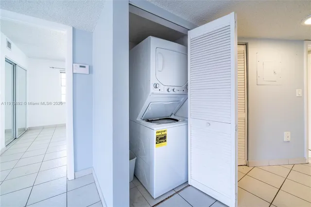 a stove top oven sitting inside of a kitchen