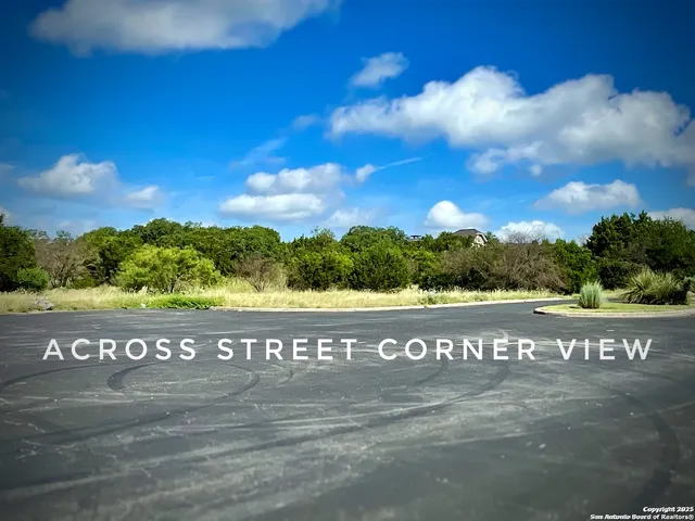 a view of a field with an ocean view