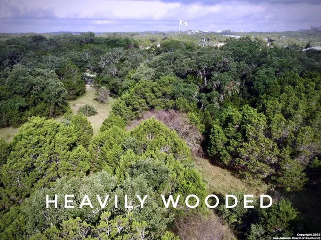 a view of a street with a building in the background