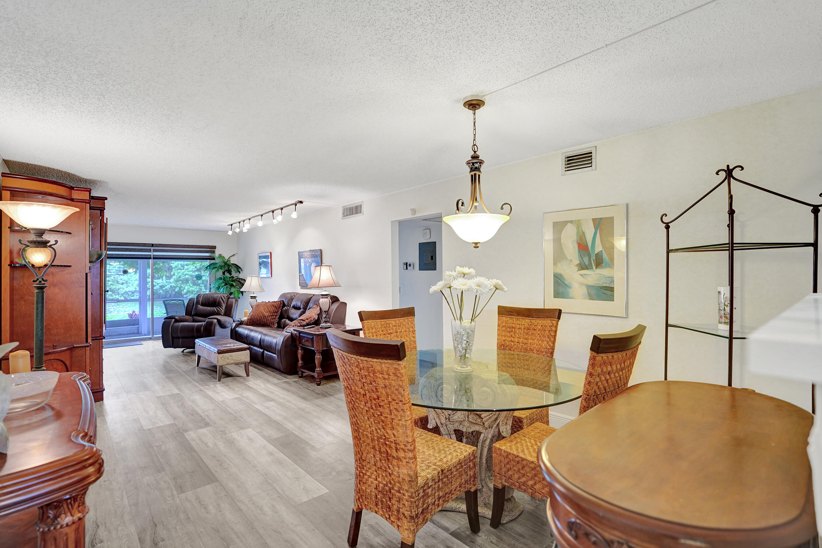 1033 Ainslie C Boca Raton, FL 33434 - Photo 11 of 42 a living room with furniture and a wooden floor