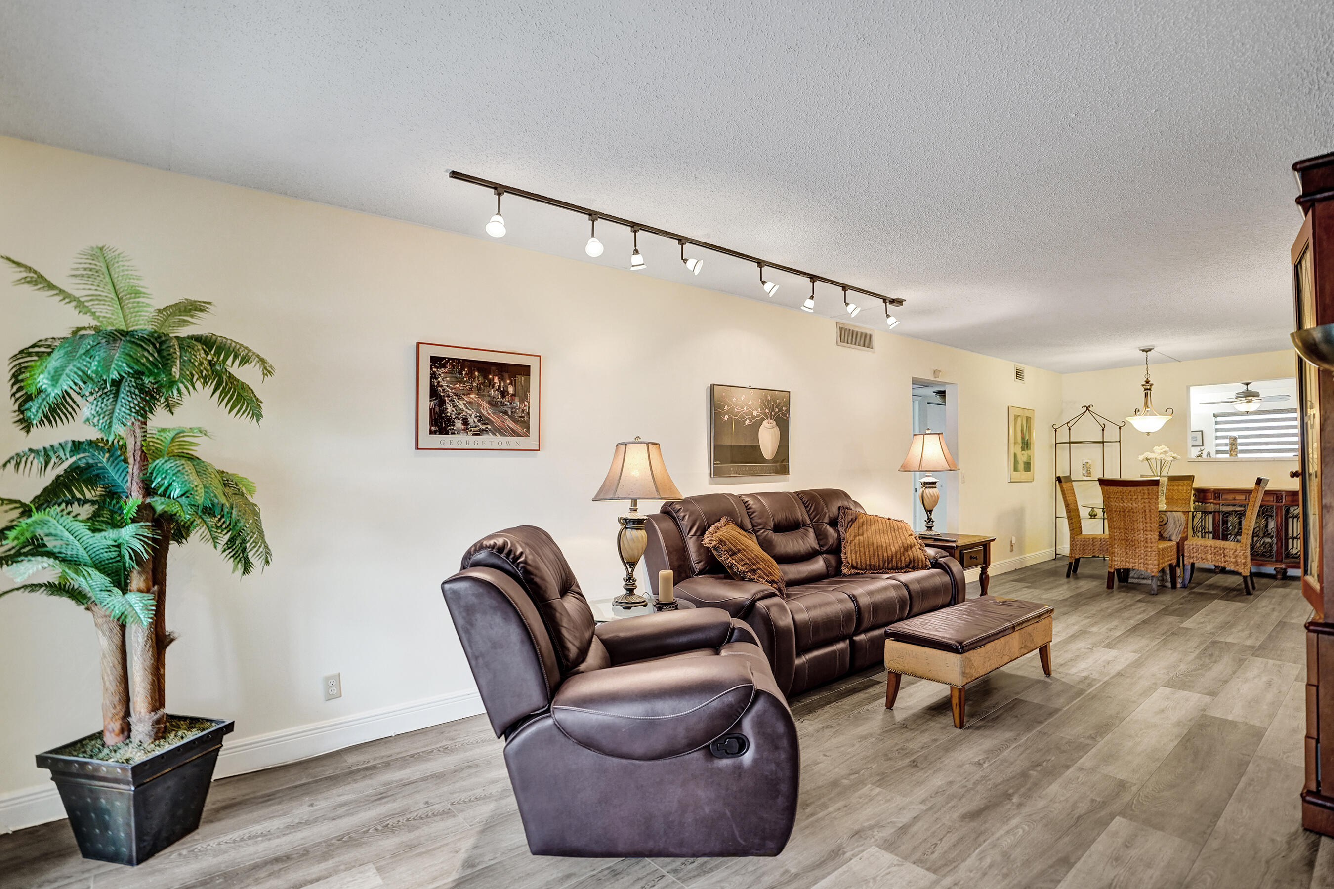 1033 Ainslie C Boca Raton, FL 33434 - Photo 18 of 42 a living room with furniture potted plant and a table