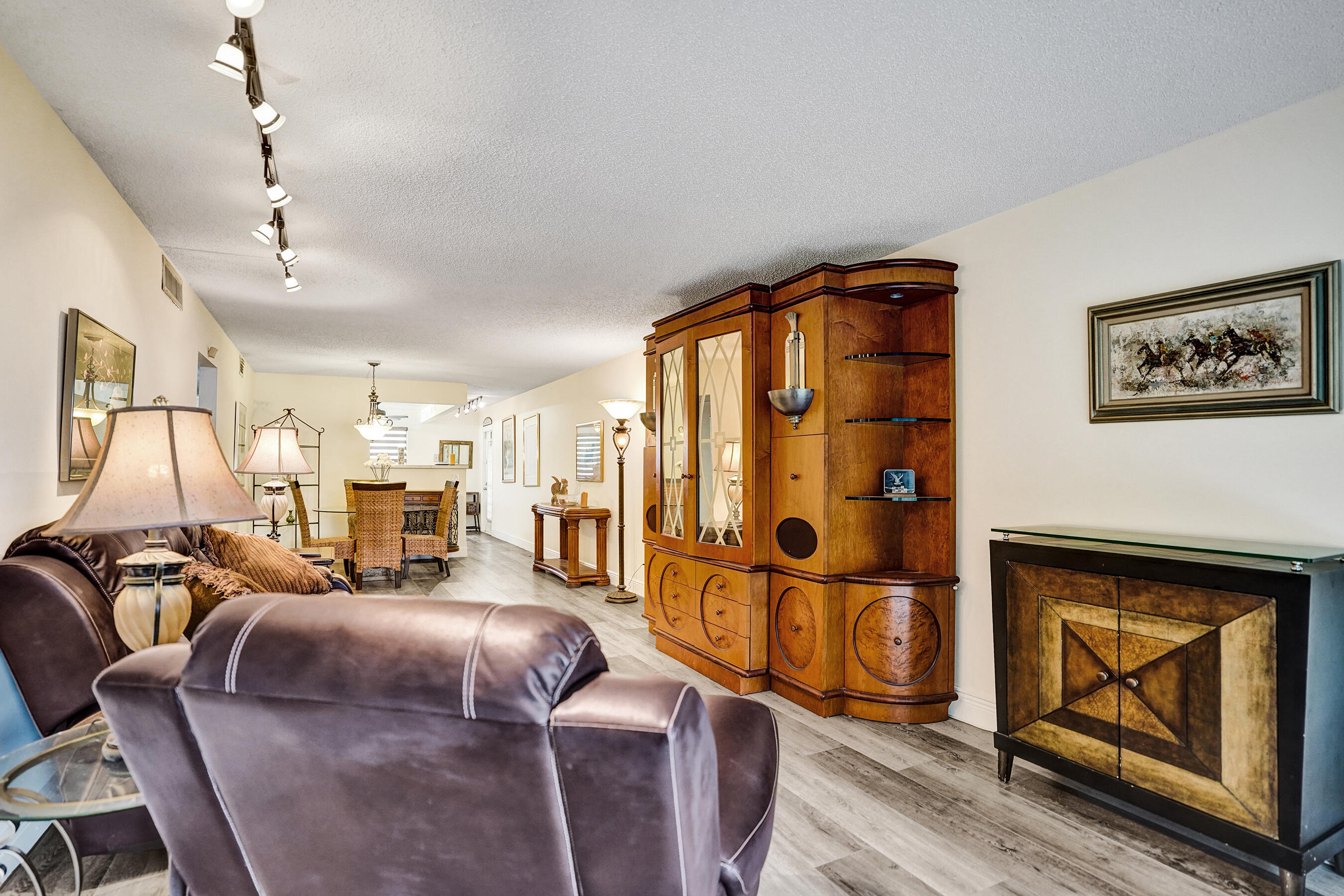 1033 Ainslie C Boca Raton, FL 33434 - Photo 20 of 42 a living room with furniture a ceiling fan and a rug