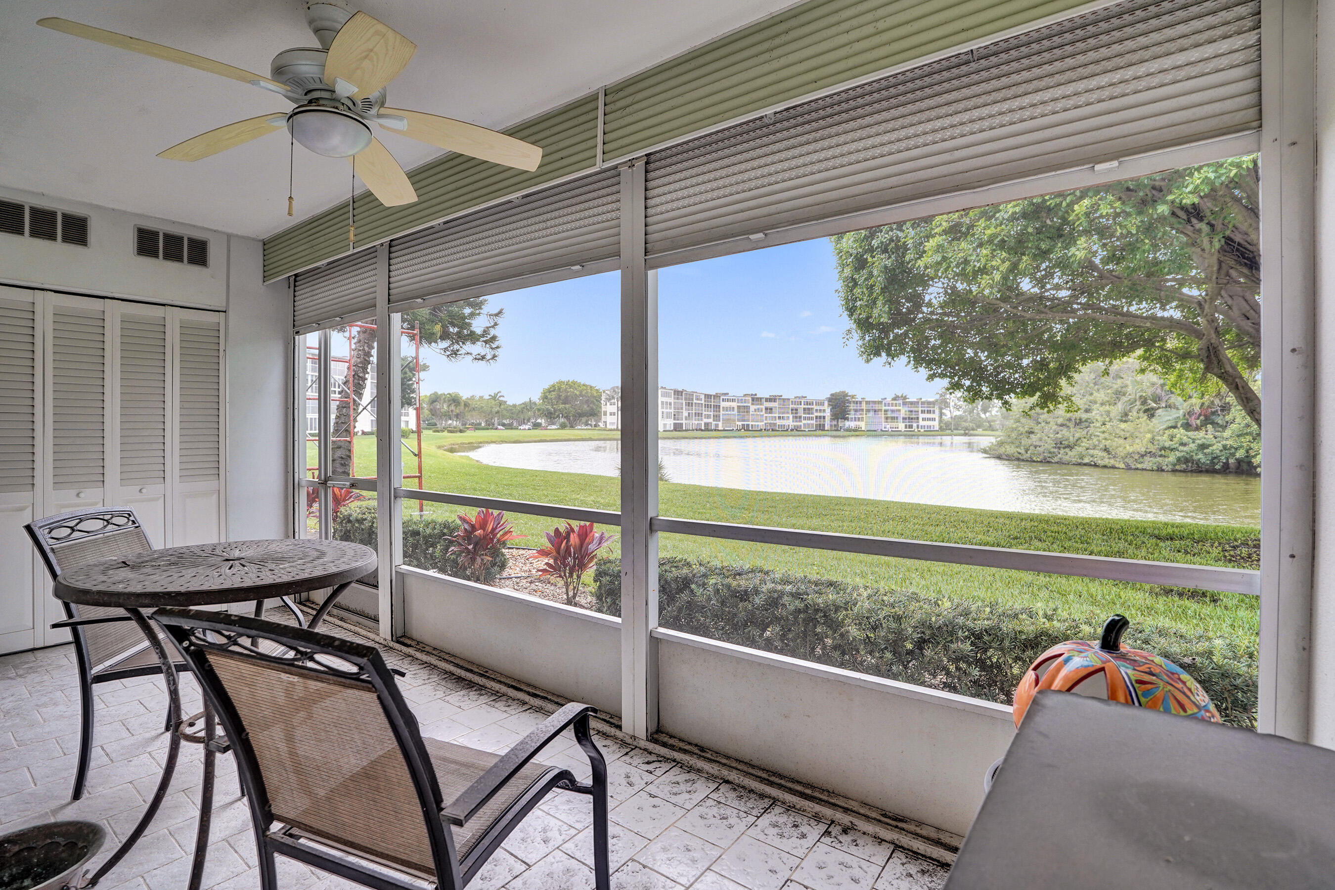 1033 Ainslie C Boca Raton, FL 33434 - Photo 36 of 42 a view of a porch with furniture and a yard