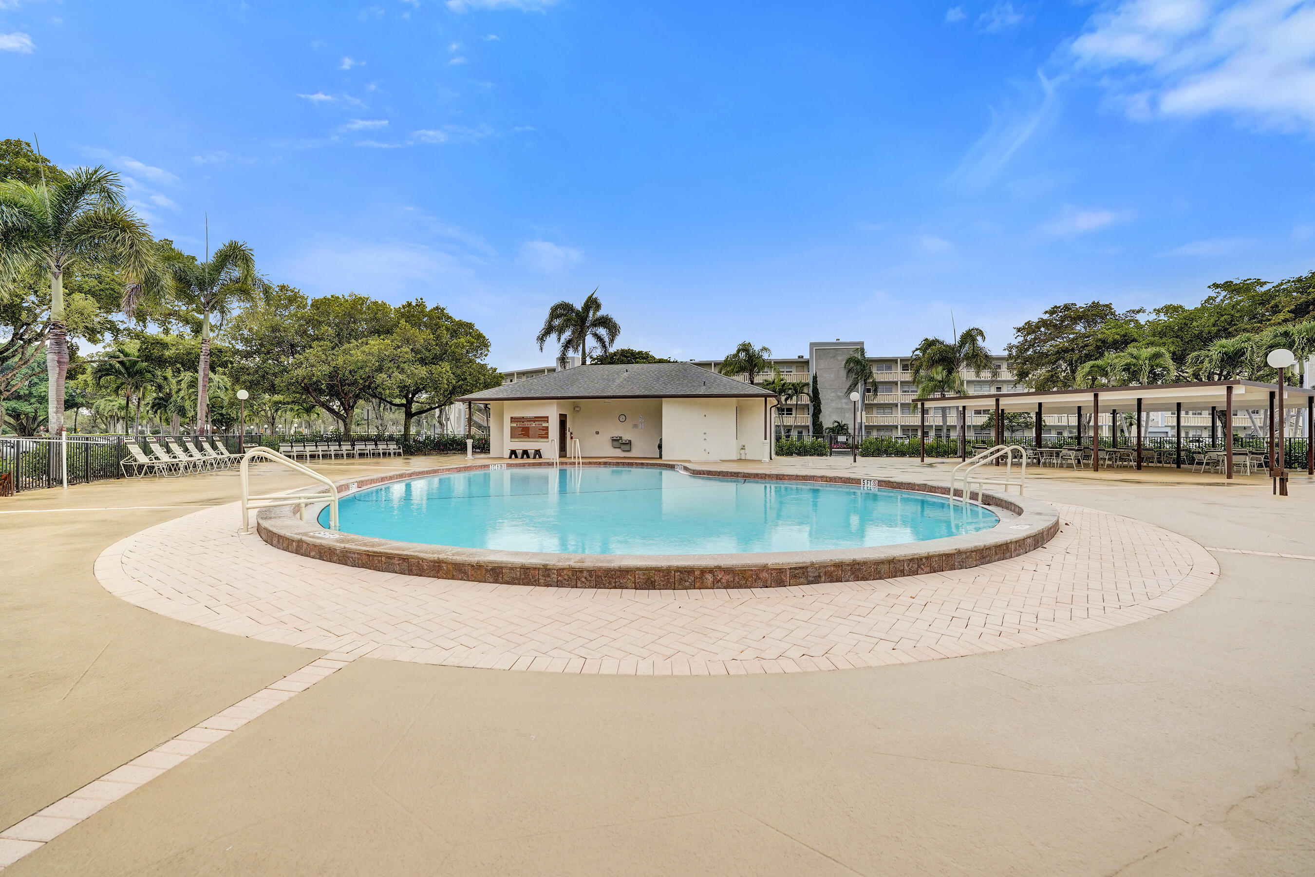 1033 Ainslie C Boca Raton, FL 33434 - Photo 42 of 42 a view of a house with a swimming pool