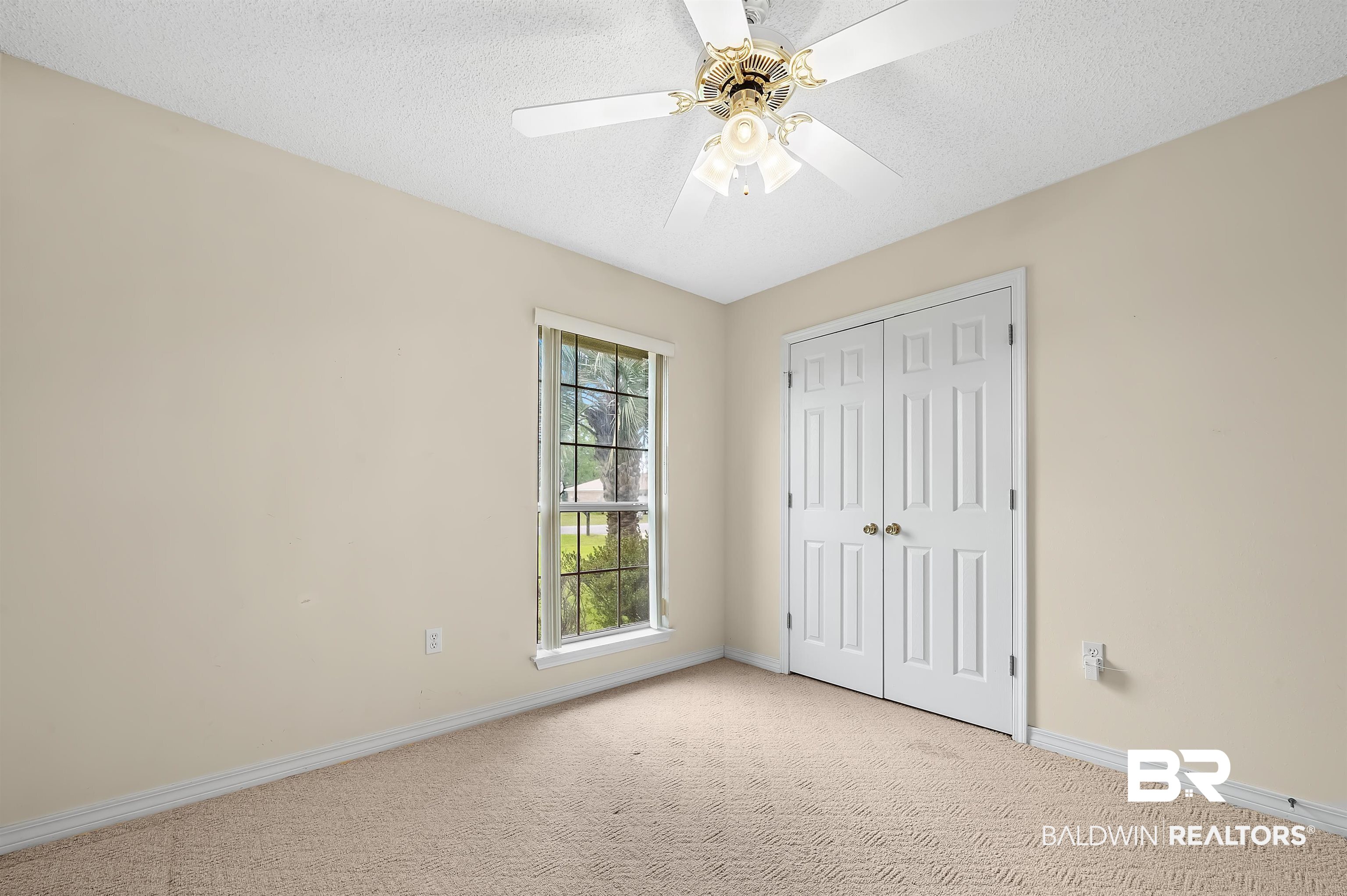 1502 Mulberry Lane Foley, AL 36535 - Photo 32 of 45 Unfurnished bedroom with a textured ceiling, light colored carpet, a closet, and ceiling fan