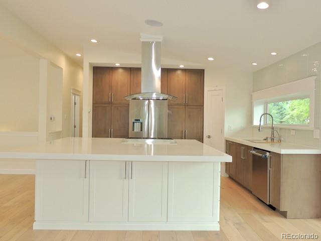 3255 Field Street Wheat Ridge, CO 80033 - Photo 15 of 35 a large kitchen with kitchen island a sink stainless steel appliances and cabinets