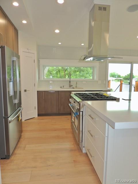 3255 Field Street Wheat Ridge, CO 80033 - Photo 16 of 35 a view of kitchen with stainless steel appliances granite countertop a sink and a refrigerator