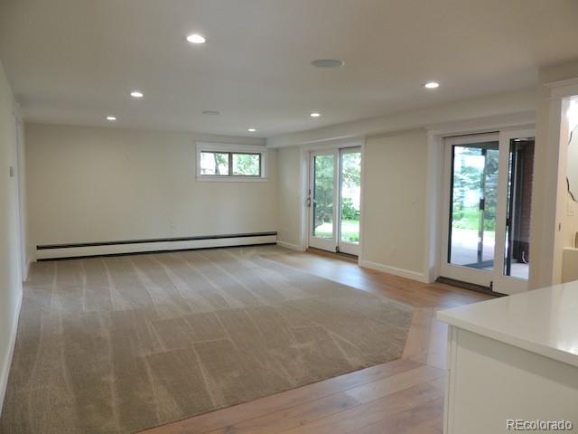 3255 Field Street Wheat Ridge, CO 80033 - Photo 27 of 35 an empty room with wooden floor and windows