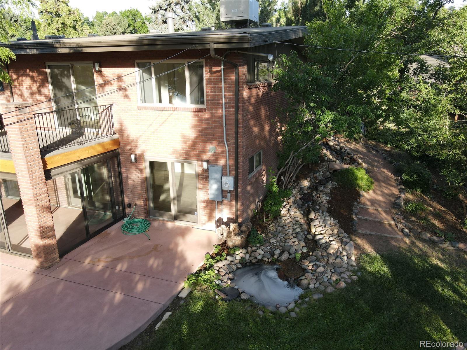 3255 Field Street Wheat Ridge, CO 80033 - Photo 9 of 35 a front view of a house with a yard