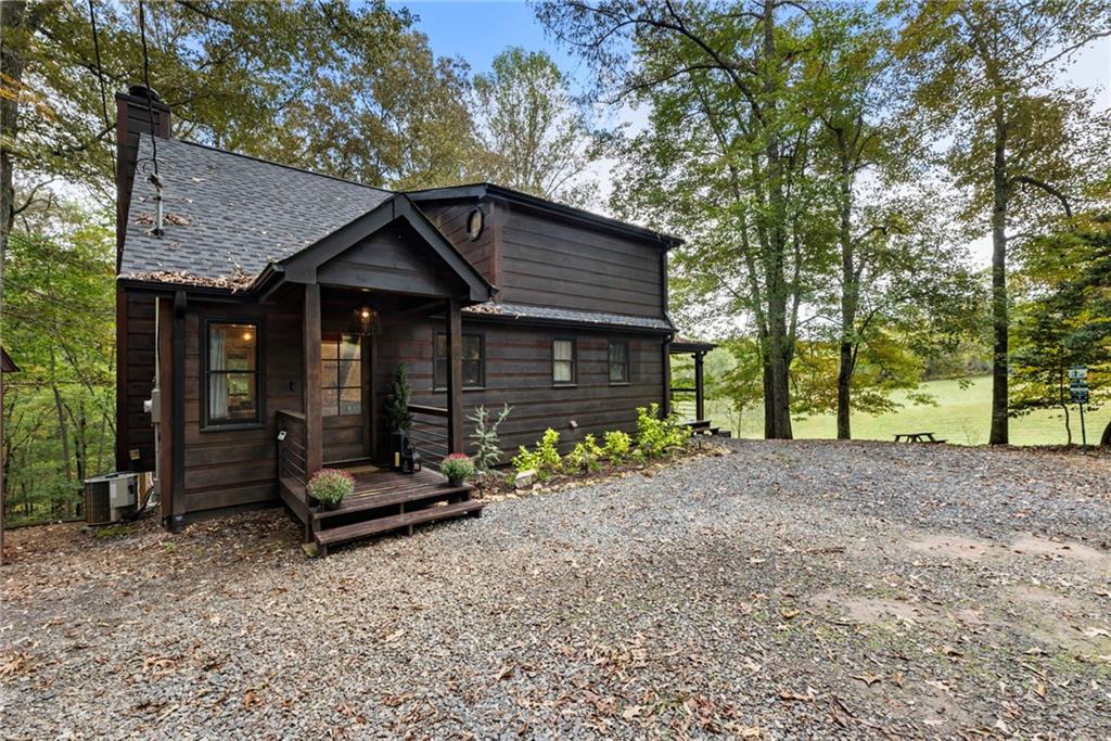 120 Brookhaven Trail Blue Ridge, GA 30513 - Photo 3 of 100 a front view of a house with garden