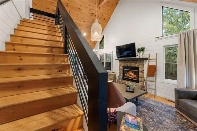 a dining room with furniture and wooden floor