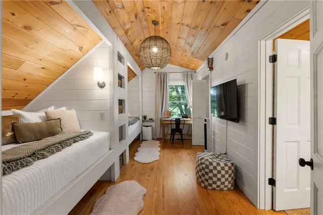 a kitchen view with a sink and chairs