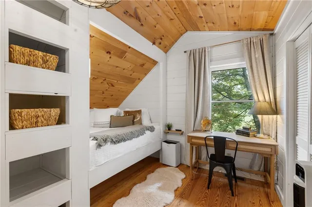 a spacious bedroom with a bed and a couch