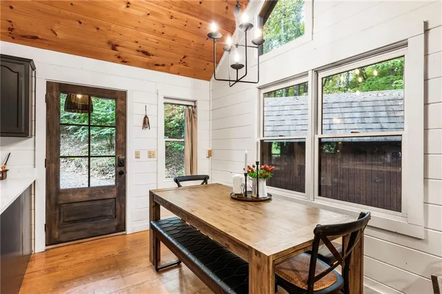 a kitchen with a sink cabinets and wooden floor