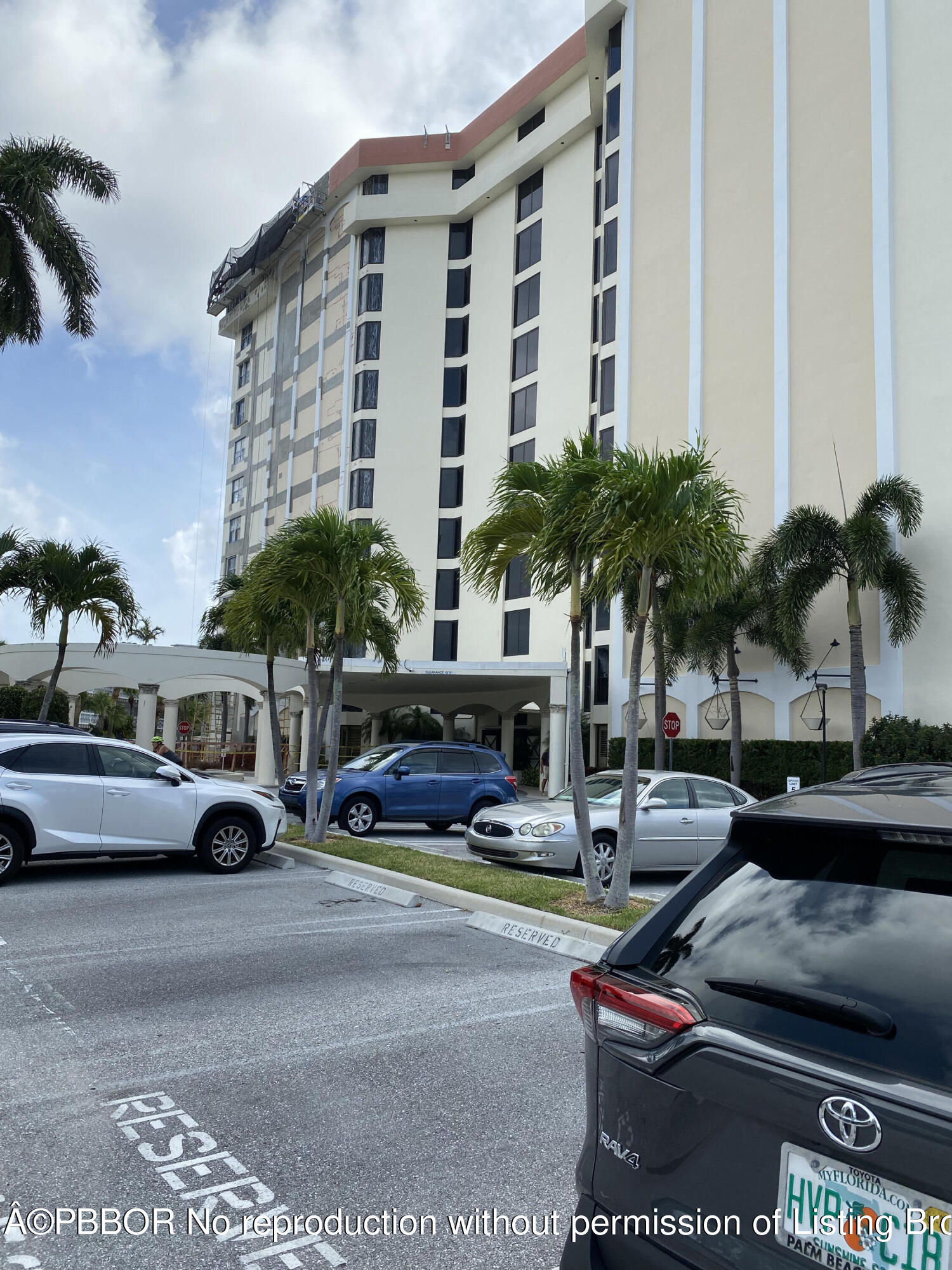 3800 Washington Road, Unit 610 West Palm Beach, FL 33405 - Photo 13 of 13 a cars parked in front of a building