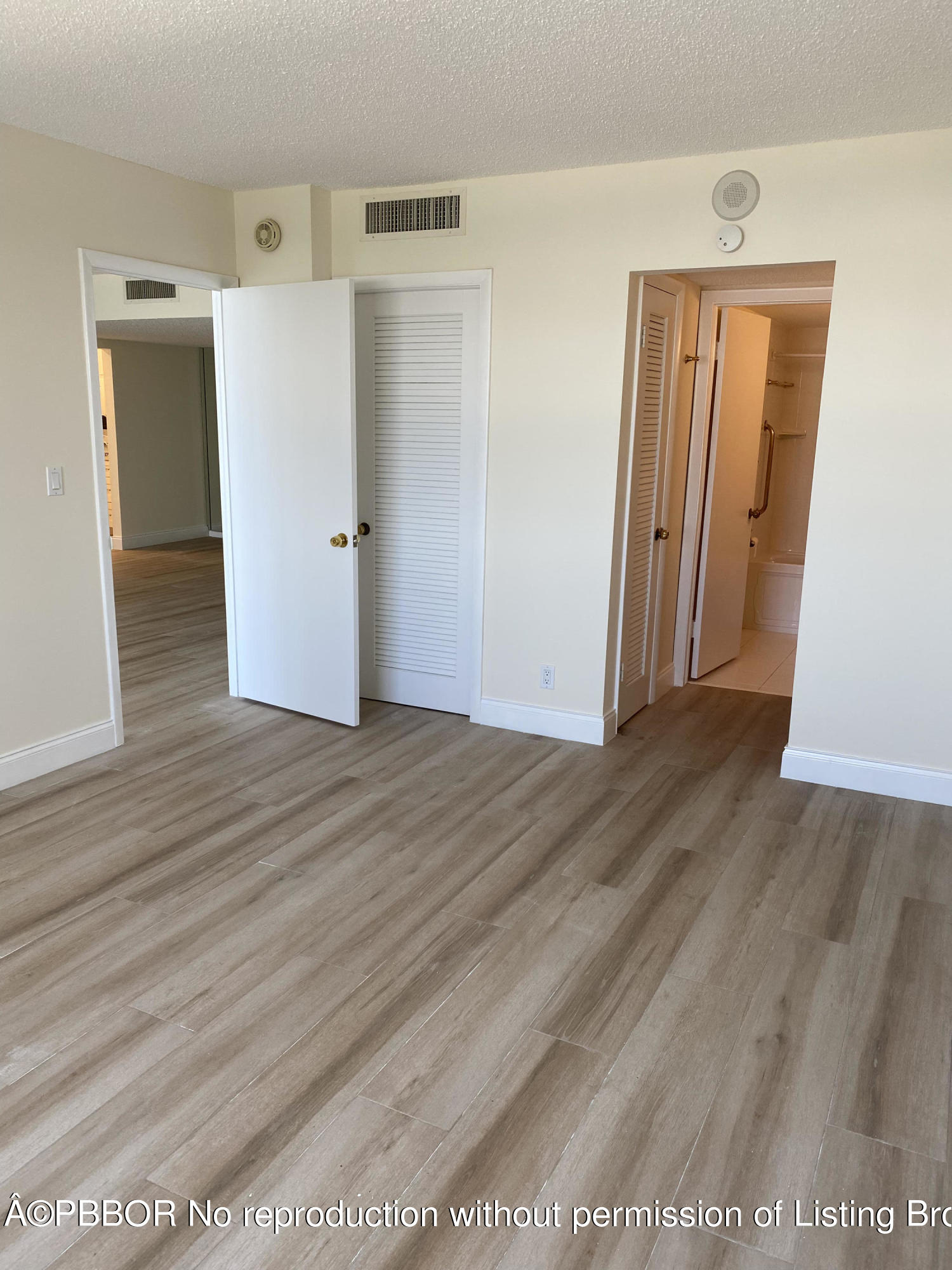 3800 Washington Road, Unit 610 West Palm Beach, FL 33405 - Photo 8 of 13 a view of hallway with wooden floor