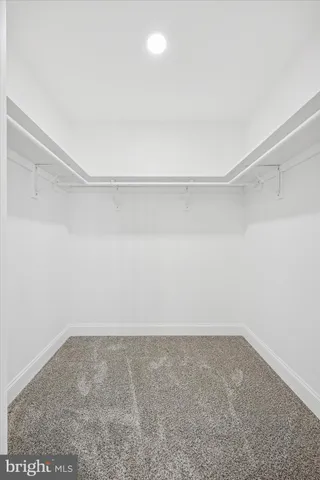 a bathroom with a sink mirror vanity and toilet