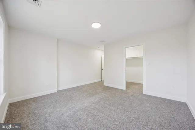 a view of a room with shelf on the wall
