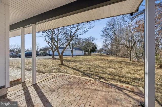 a view of kitchen with wooden floor and windows