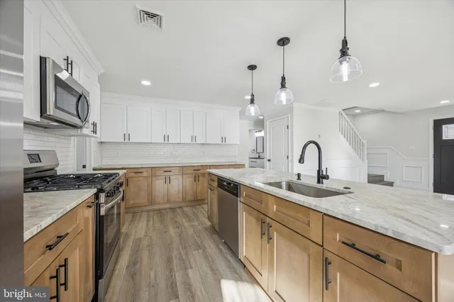 a room with linen closet and wooden floor