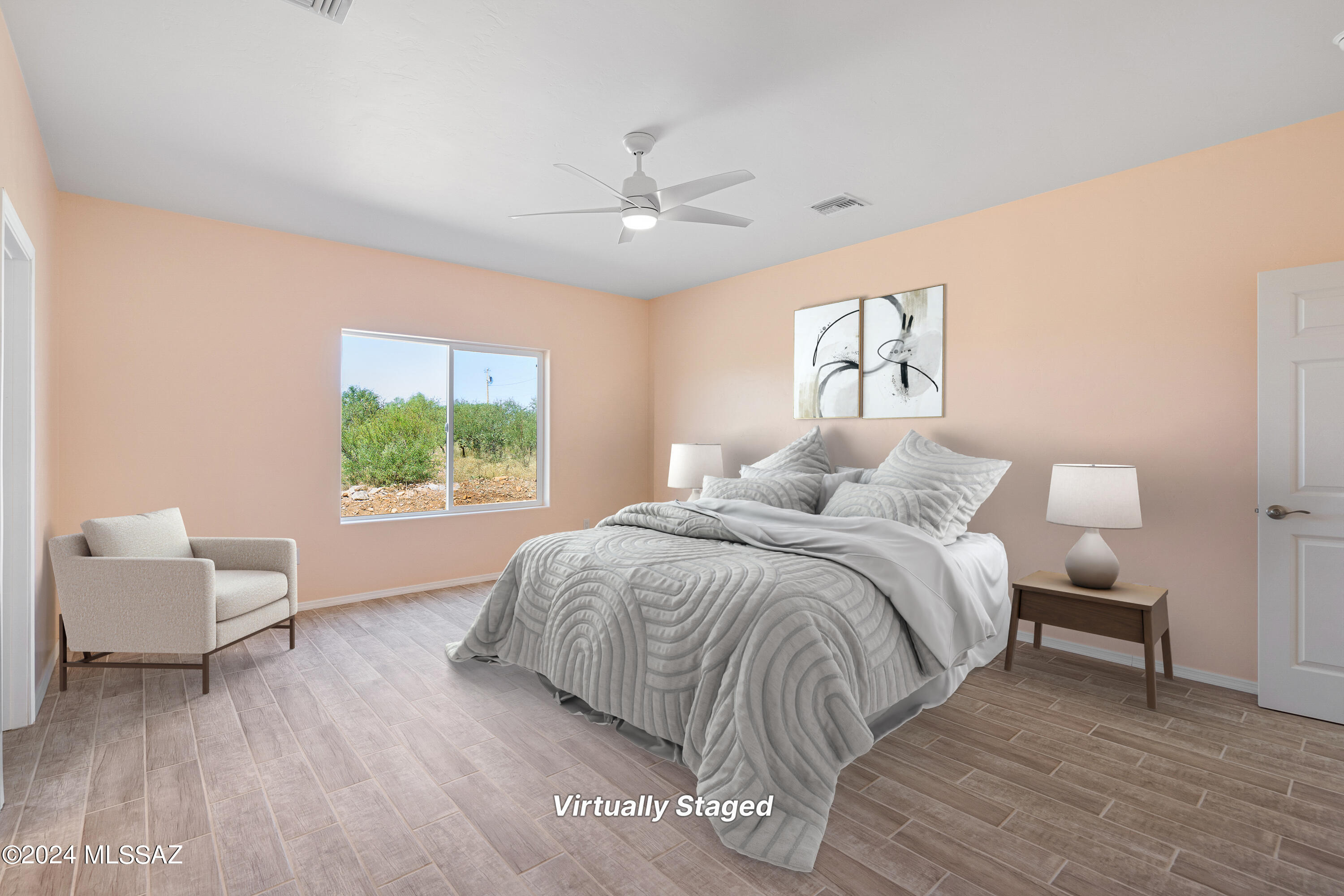 91 Avenida De Las Naciones Rio Rico, AZ 85648 - Photo 13 of 36 a spacious bedroom with a bed and a couch
