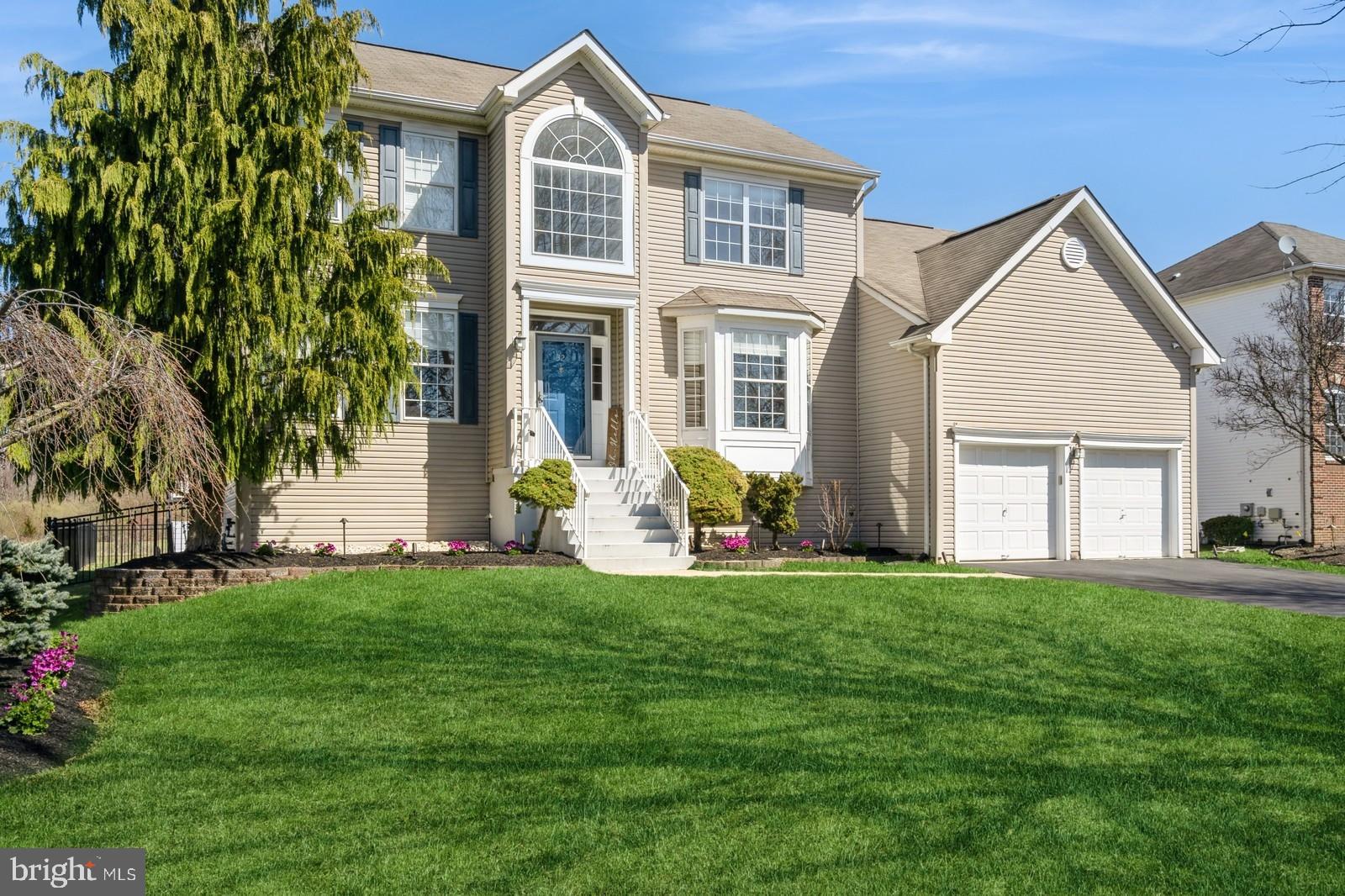 32 Moorsgate Circle Hightstown, NJ 08520 - Photo 1 of 49 a front view of a house with a garden