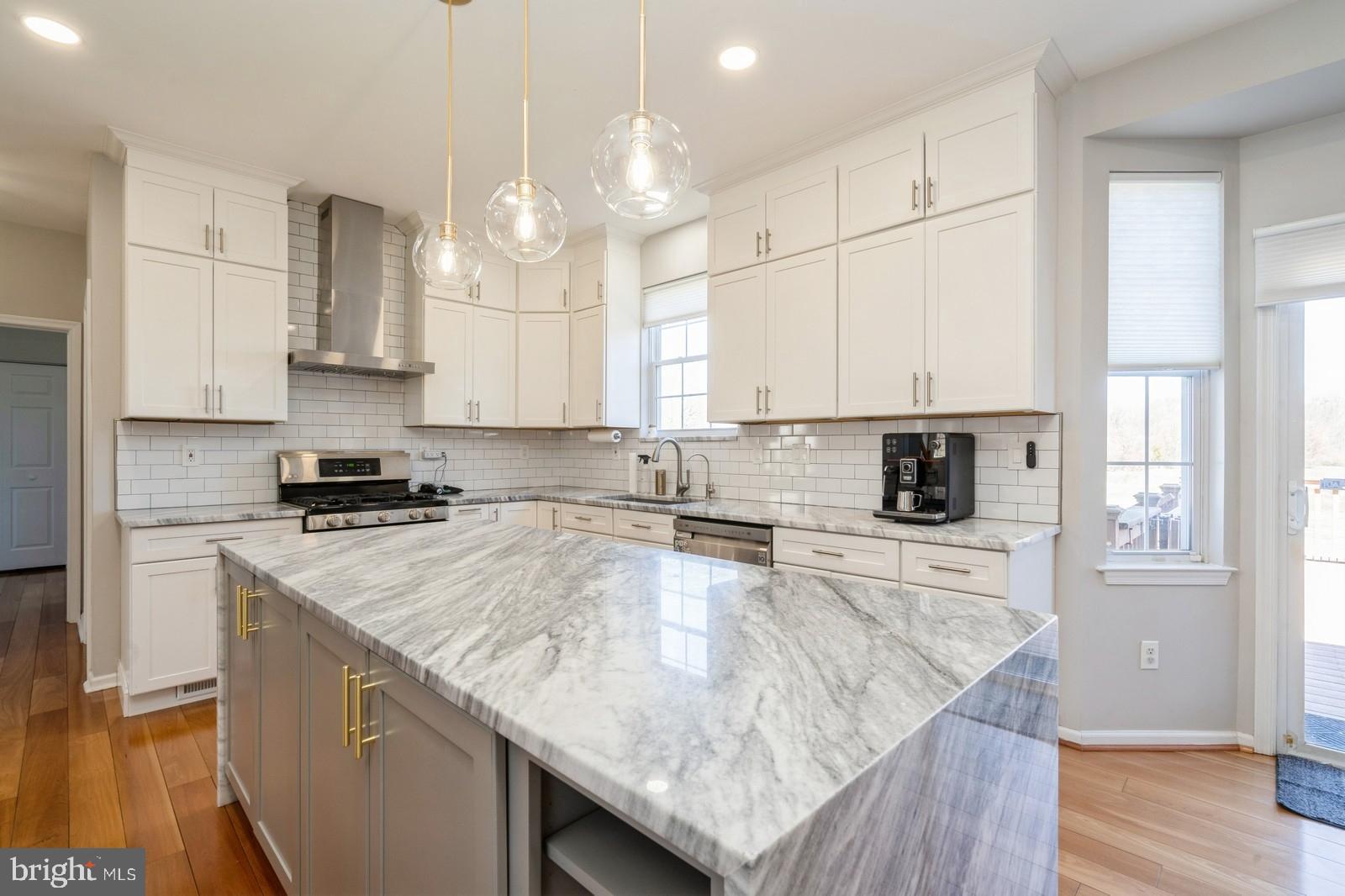 32 Moorsgate Circle Hightstown, NJ 08520 - Photo 14 of 49 a kitchen with stainless steel appliances granite countertop a sink stove and refrigerator