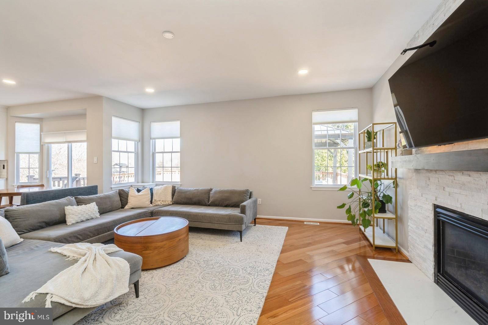 32 Moorsgate Circle Hightstown, NJ 08520 - Photo 17 of 49 a living room with furniture flat screen tv and a fireplace