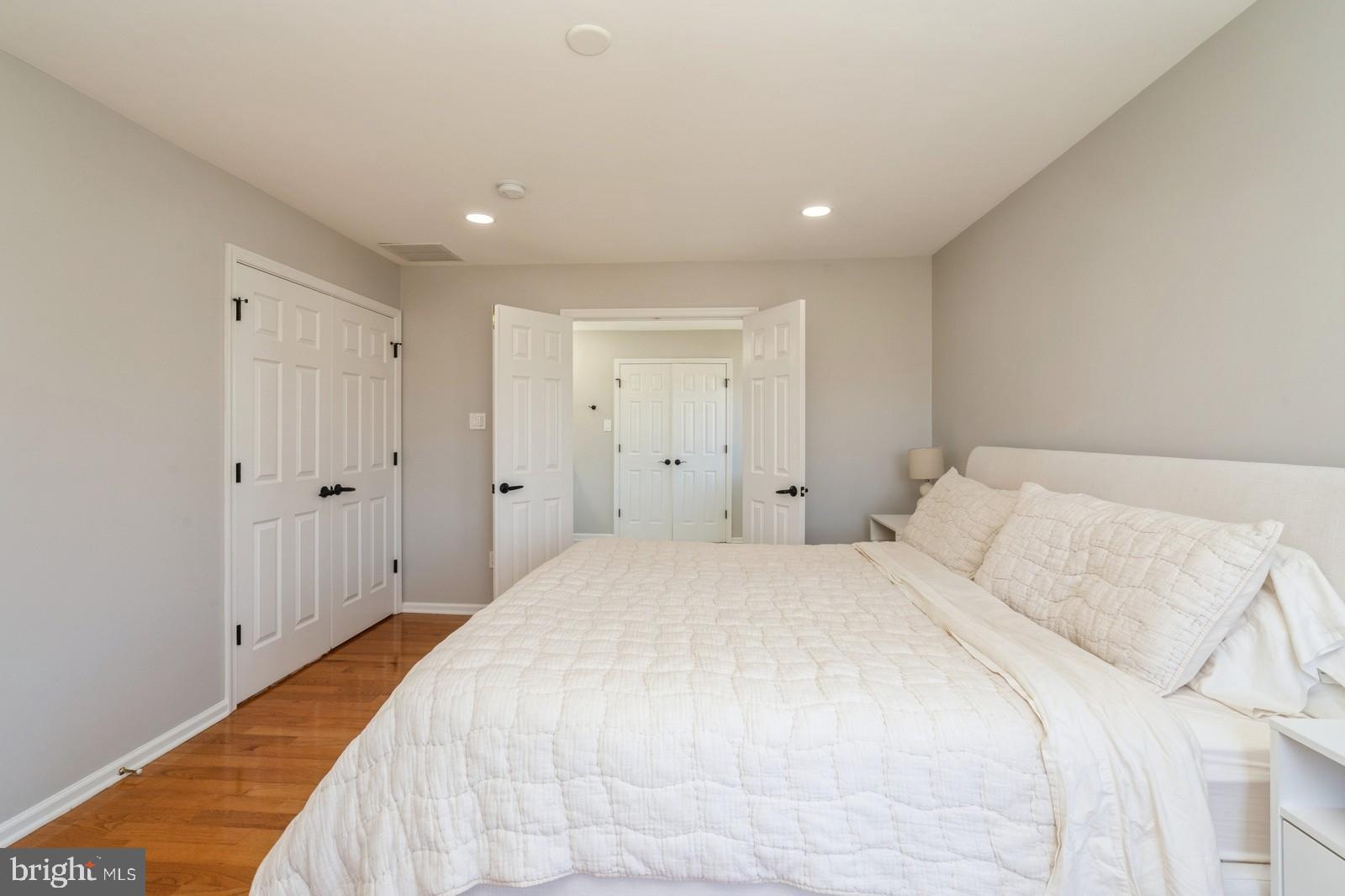 32 Moorsgate Circle Hightstown, NJ 08520 - Photo 25 of 49 a spacious bedroom with a bed and a chandelier