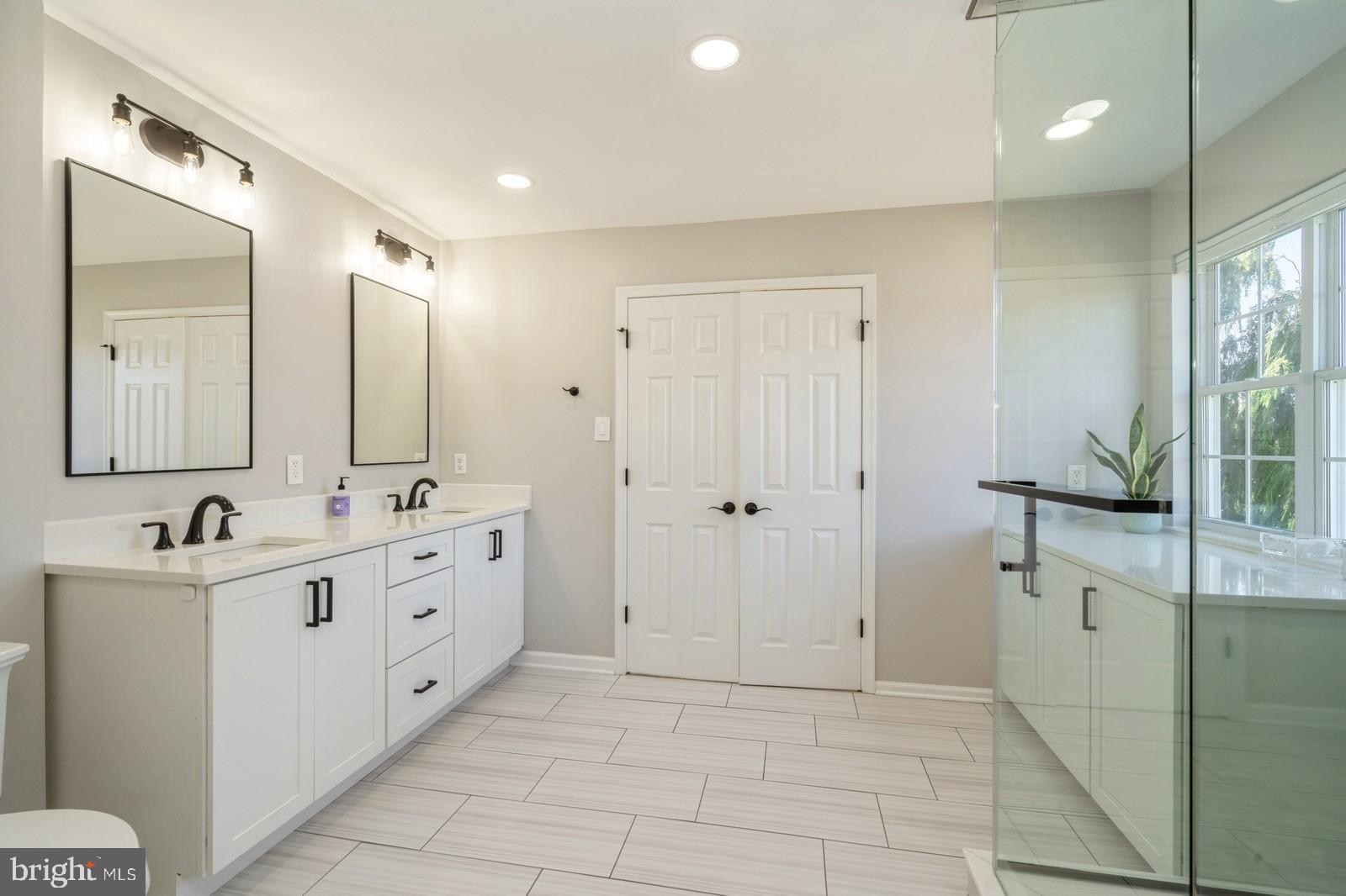 32 Moorsgate Circle Hightstown, NJ 08520 - Photo 26 of 49 a bathroom with a double vanity sink mirror and bathtub