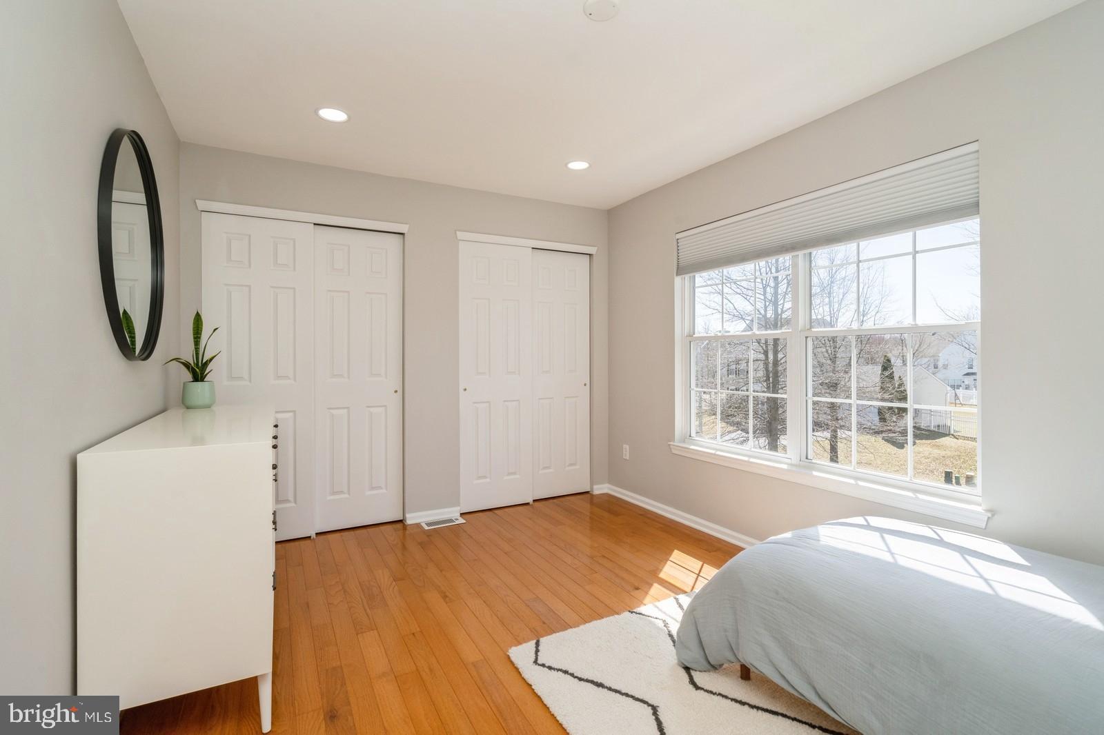 32 Moorsgate Circle Hightstown, NJ 08520 - Photo 34 of 49 a bedroom with a bed and a large window
