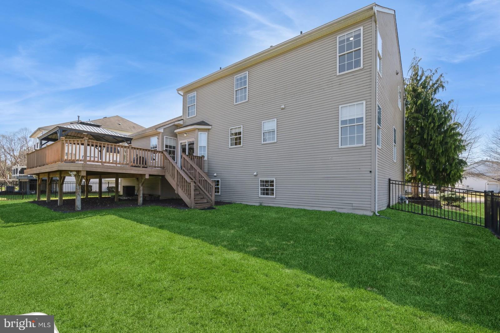 32 Moorsgate Circle Hightstown, NJ 08520 - Photo 48 of 49 a view of a house with a backyard