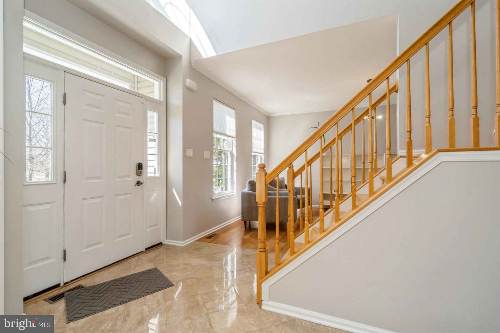 32 Moorsgate Circle Hightstown, NJ 08520 - Photo 5 of 49 a view of an entryway with wooden floor and stairs