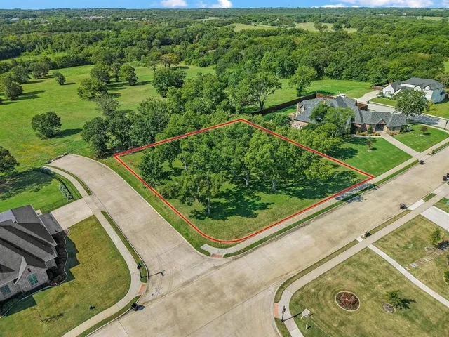 a view of a garden from a balcony