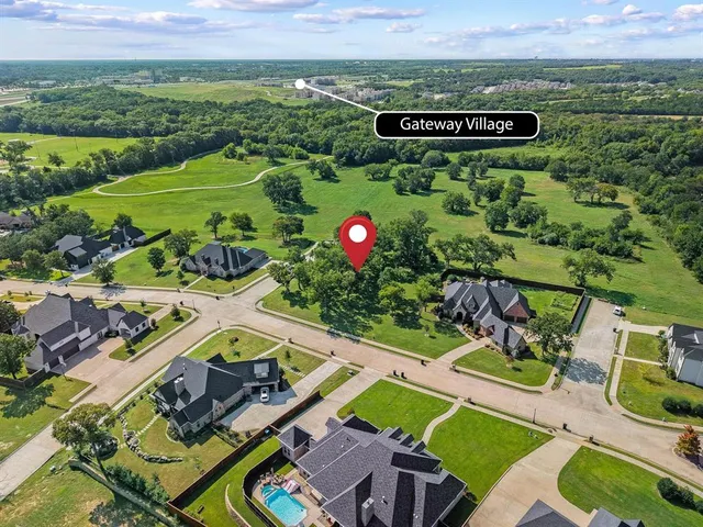 an aerial view of a house with a garden