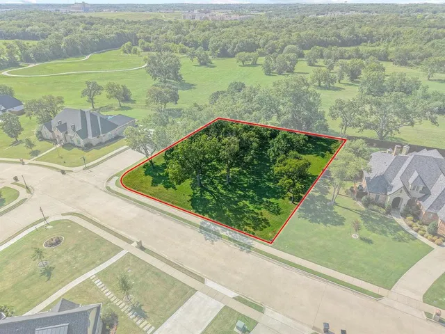 a view of a garden from a balcony