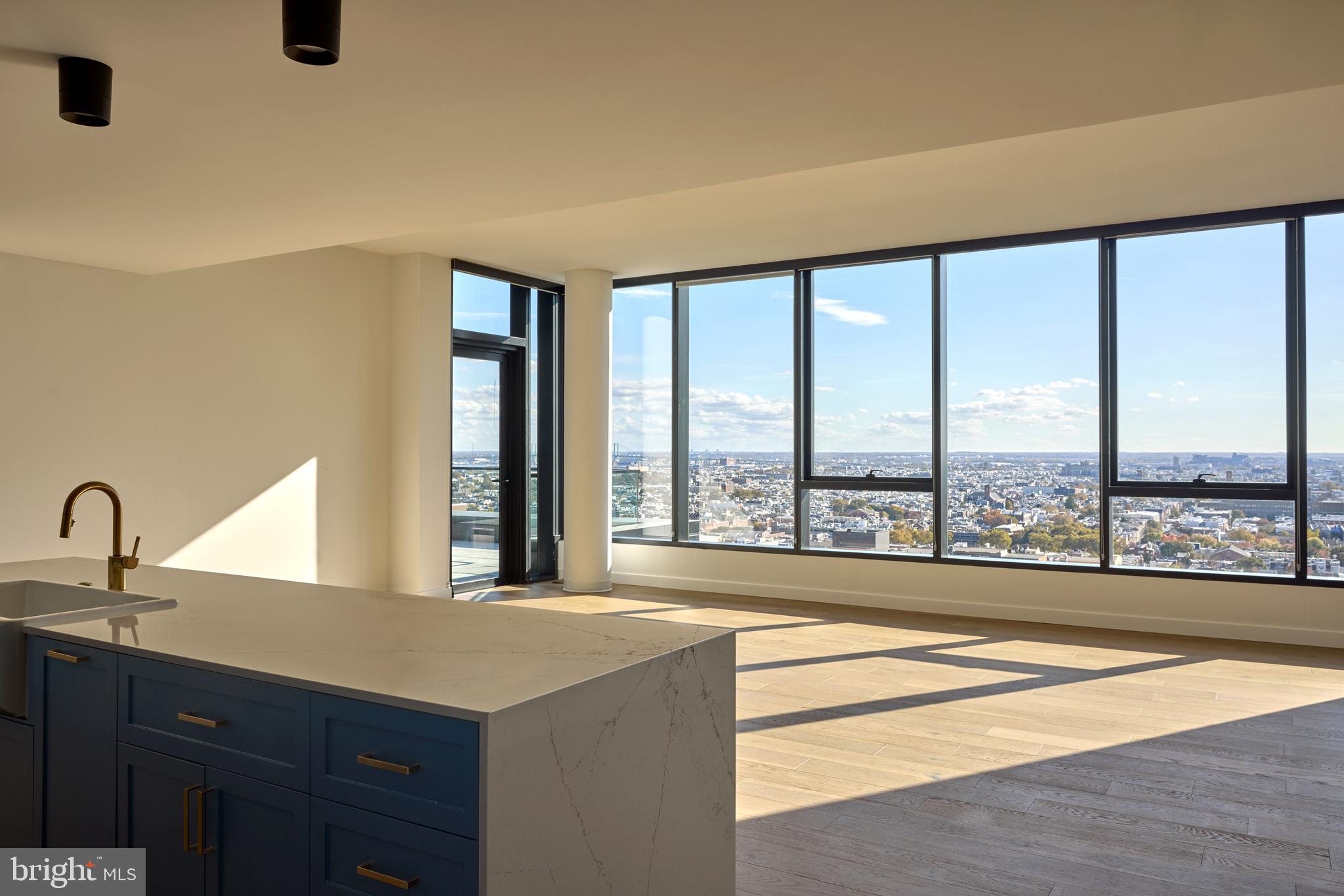 1134 Sansom Street, Unit 3BPH2001 Philadelphia, PA 19107 - Photo 19 of 33 a living room with a large window