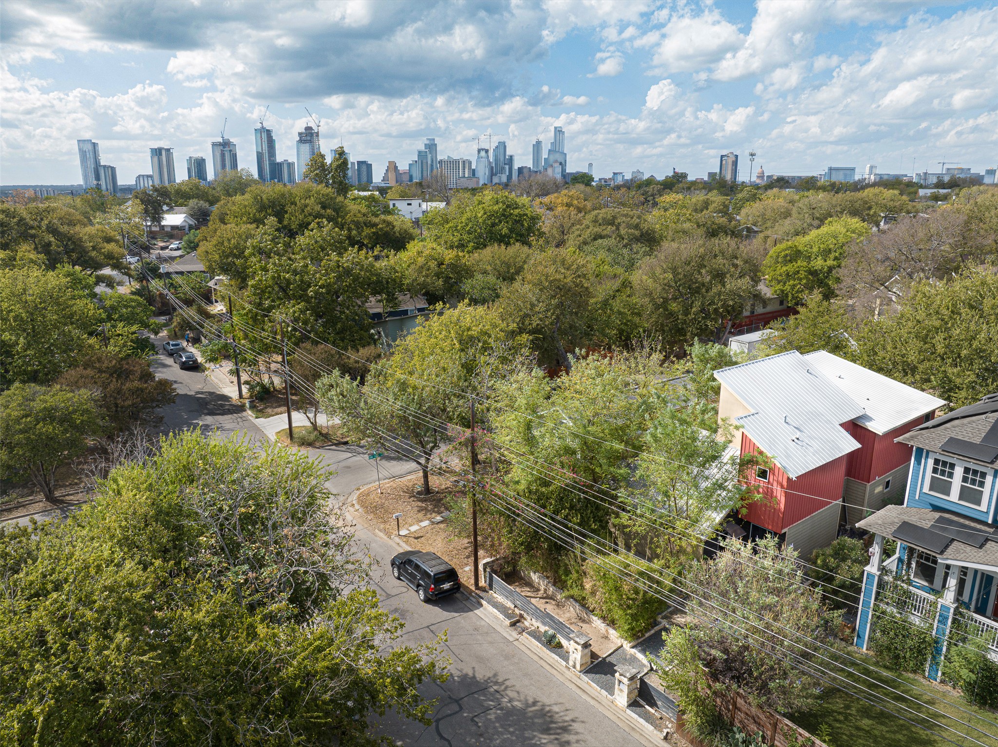 2302 East 9th Street Austin, TX 78702 - Photo 4 of 31 Overlooking a verdant neighborhood, this property offers serene living with vibrant city views.