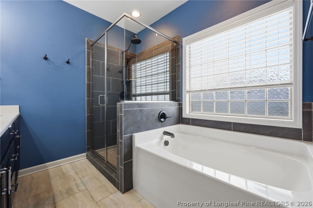 33 Colonist Place Cameron, NC 28326 - Photo 25 of 47 a bathroom with a bathtub and a shower